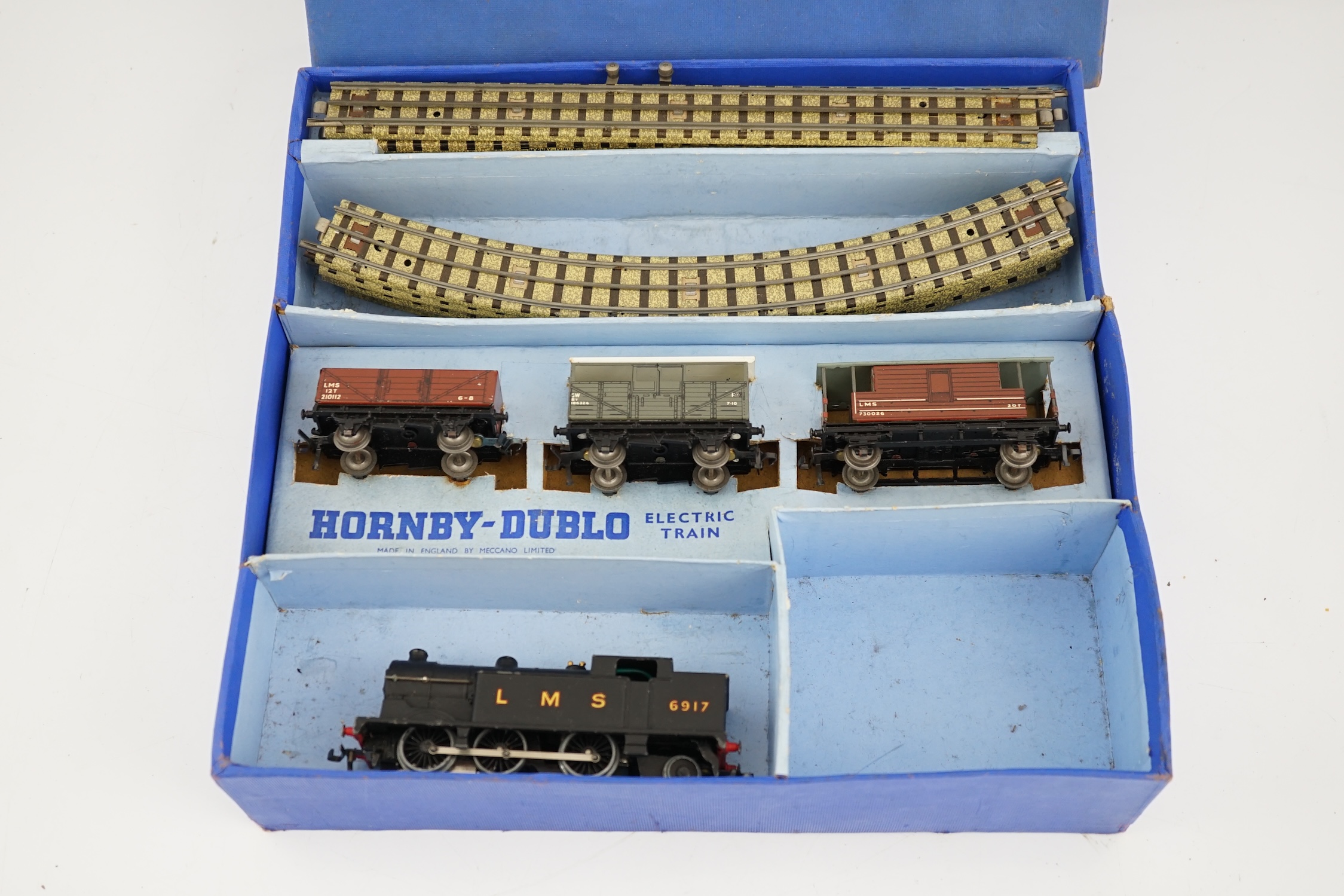 A collection of Hornby Dublo railway for 3-rail running, including; a boxed EDG7 Tank Goods Train set comprising an LMS Class N2 0-6-2 locomotive, 6917, freight wagons and track sections